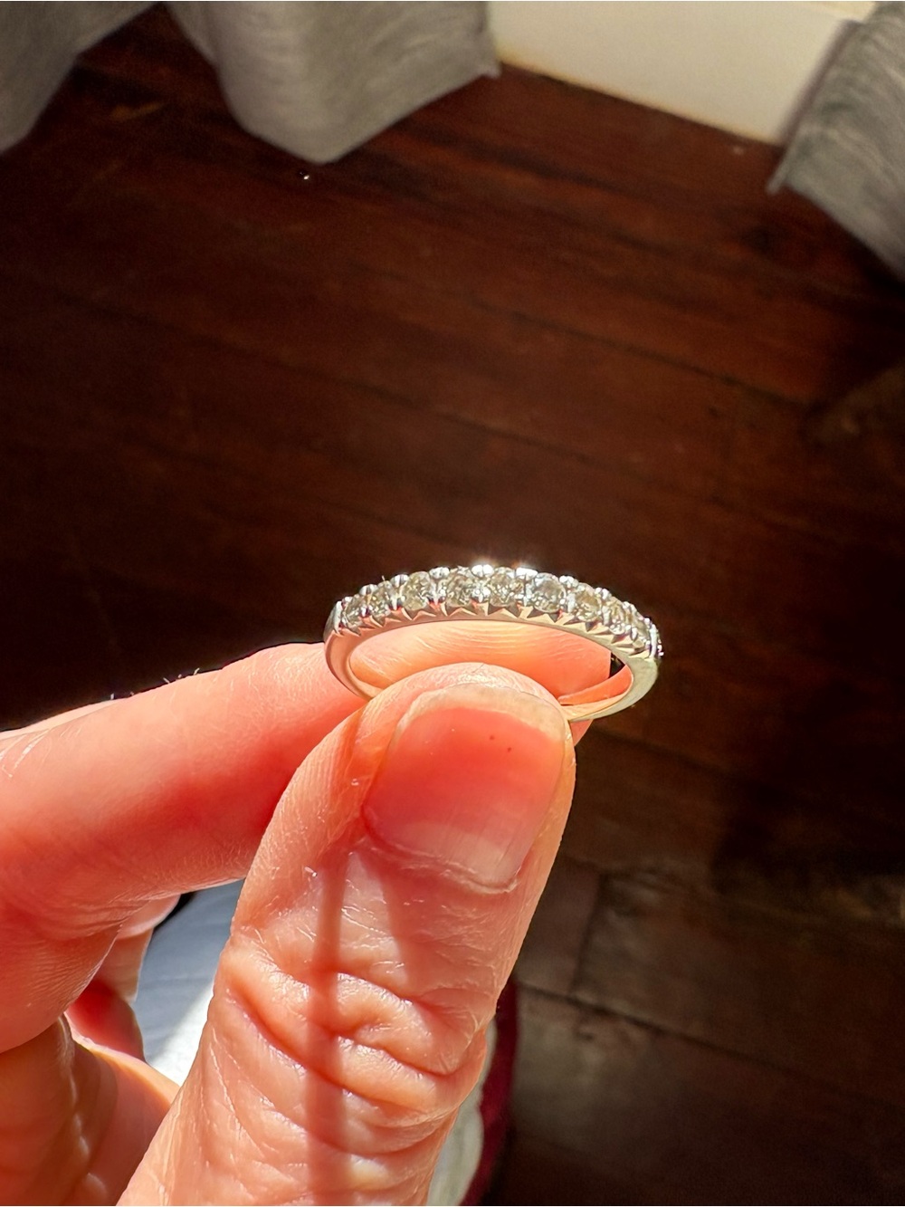 White gold diamond band. Possibly size 8. 10 diamonds.
